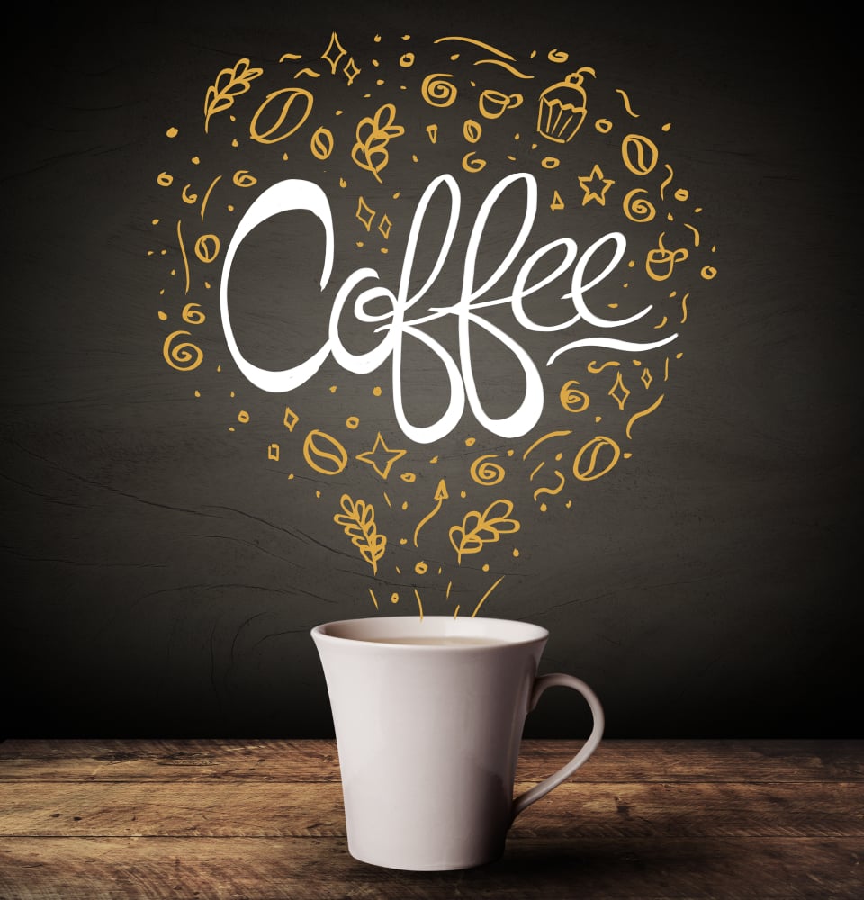 Steaming hot drink decorated with doodle illustrations and coffee inscription